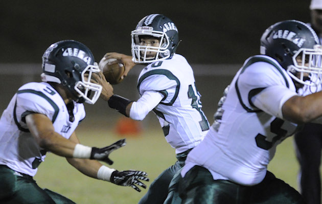 Aiea head coach Wendell Say light-heartedly likened his varsity squad to the "little train that could" in its matchup against defending Division I state champion Kahuku on Friday. In photo, senior quarterback Kobe Kato went back to pass in a game during his sophomore season. Bruce Asato / Honolulu Star-Advertiser.