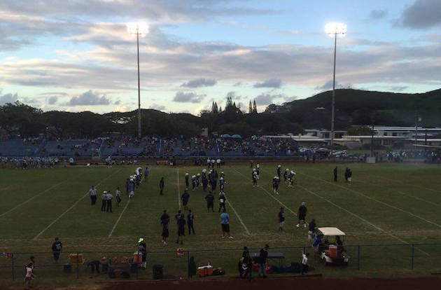 Kailua warmed up for its season opener against Moanalua on Saturday night. Photo by Brian McInnis/Star-Advertiser.