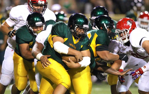 Leilehua running back Kalika Seumanutafa-Bryant is not easy to bring down. Photo by Jamm Aquino/Star-Advertiser.