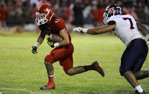 Kahuku's Elvis Vakapuna rushed for two touchdowns in a win over Waianae. Photo by Bruce Asato/Star-Advertiser.