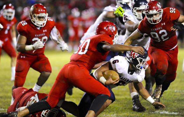 Kahuku's defense swarmed Waianae running back Rico Rosario earlier this year. Photo by Bruce Asato/Star-Advertiser.