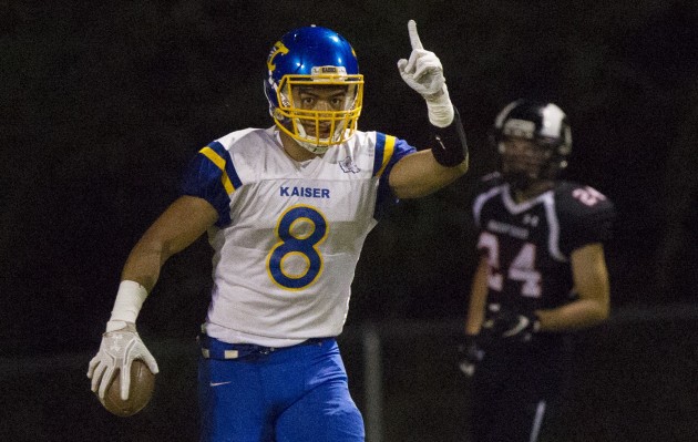 Kaiser's Andrew Kaufusi celebrated one of his three touchdowns scored against Radford during his senior year. Cindy Ellen Russell / Honolulu Star-Advertiser. 