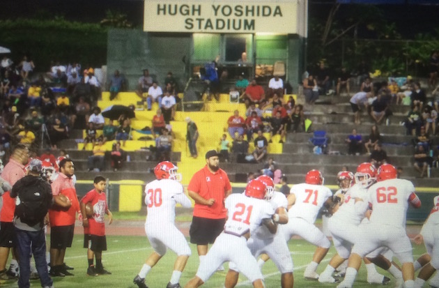 Kahuku warmed up for its season debut against Leilehua on Friday night at Hugh Yoshida Stadium. Photo by Jamm Aquino/Star-Advertiser.