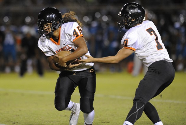 Campbell QB Kawika Ulufale, right, and RB Tasi Faumui lead the Sabers offense. Photo by Bruce Asato/Star-Advertiser.