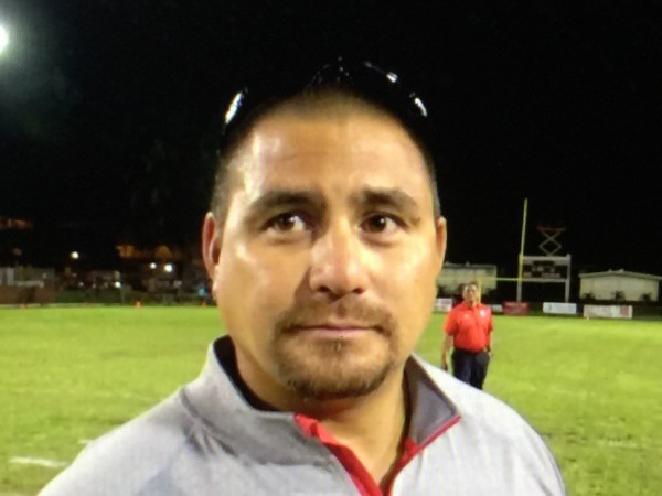 Kahuku offensive coordinator John Hao chatted after the Red Raiders' win over Waianae. Saturday, Aug. 27, 2016. 
