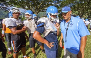 Linebacker Sione Vanisi listened to coach Kip Akana during practice.  Photo by Dennis Oda/Star-Advertiser.