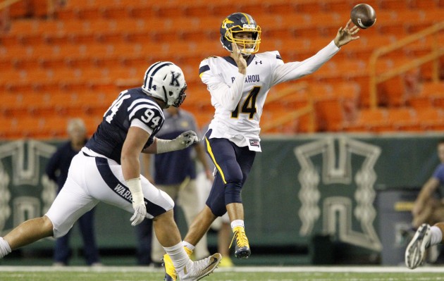 Punahou quarterback Nick Kapule unleashed a pass while under pressure from Kamehameha's Nakoa Pauole on Thursday at Aloha Stadium. 2016 September 1 SPT - HSA photo by George F. Lee / GLEE@STARADVERTISER.COM