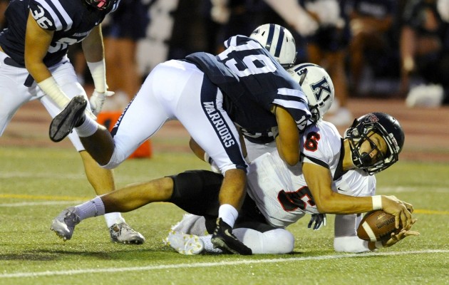 'Iolani's Tai-John Mizutani was stopped at the goal line in the first meeting this season against Kamehameha. Photo by Bruce Asato/Star-Advertiser.