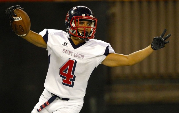 Saint Louis slotback Tosh Kekahuna-Kalawe (4) celebrates after a touchdown during the first half of an ILH football game between the Punahou Buffanblu and the Saint Louis Crusaders on Friday, September 9, 2016 at Aloha Stadium in Halawa. HSA Photo by Jamm Aquino.