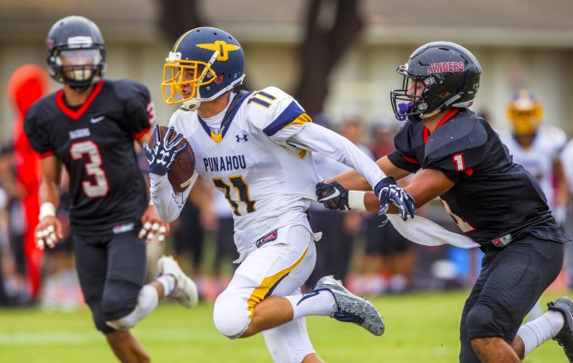 Punahou's Eamon Brady looked for yards after catching a pass from 'Iolani in a game earlier this season. Photo by Dennis Oda/Star-Advertiser.