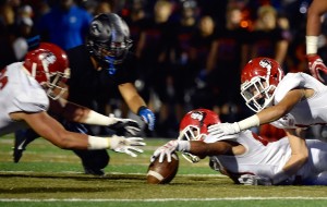 Kahuku players scrambled to recover one of three fumbles by Bishop Gorman QB Tate Martell during a 35-7 loss to the Gaels in Las Vegas in 2016. Photo by David Becker / Special to the Star-Advertiser.