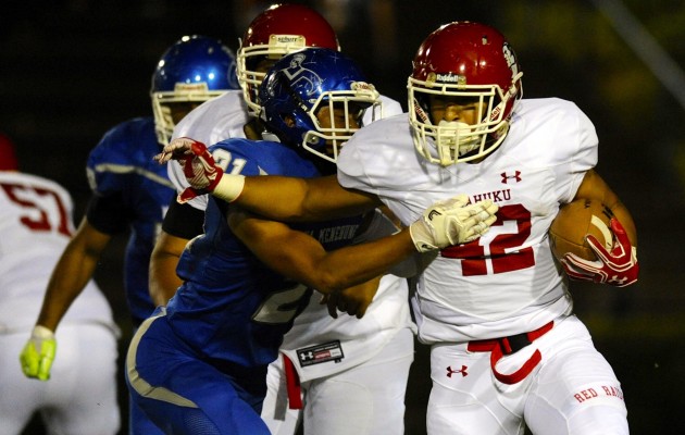 Kahuku's Elvis Vakapuna rushed for 177 yards in a win over Moanalua on Saturday. Photo by Bruce Asato/Star-Advertiser.