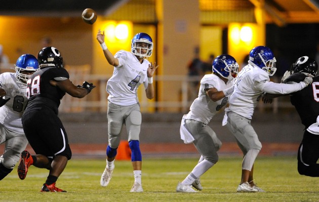 Moanalua's Alakai Yuen leads the OIA Blue with 627 passing yards and 10 passing TDs. Photo by Bruce Asato/Star-Advertiser.