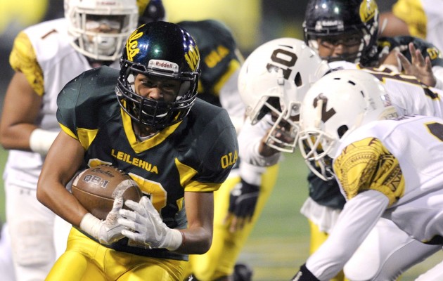 The Leilehua at Mililani game this weekend will have an effect on seeding for the Division I state tournament. In photo, the Mules' Chad Dilay ran the ball against the Trojans in a game earlier this season. Bruce Asato / Honolulu Star-Advertiser.