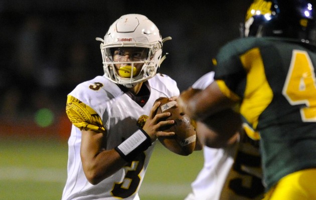 Mililani quarterback Dillon Gabriel looked for a receiver during the Trojans' win over Leilehua on Friday night. With the victory, Mililani earned a state-tournament berth as well as a bye in the first round of the Oahu Interscholastic Association playoffs. Bruce Asato / Honolulu Star-Advertiser.