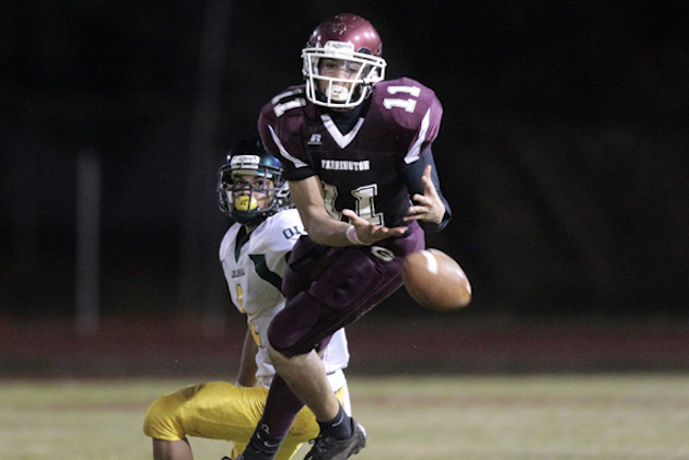 Farrington's Tevita Misinale nearly intercepted a pass intended for Leilehua's Keoni Piceno in a 2012 game at Kaiser. Photo by Jamm Aquino/Star-Advertiser.