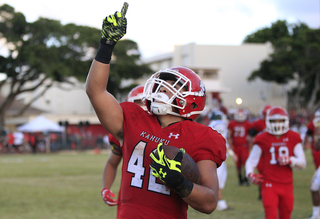 Kahuku running back Elvis Vakapuna pointed to the sky after scoring a touchdown against Aiea. Jamm Aquino/Star-Advertiser.