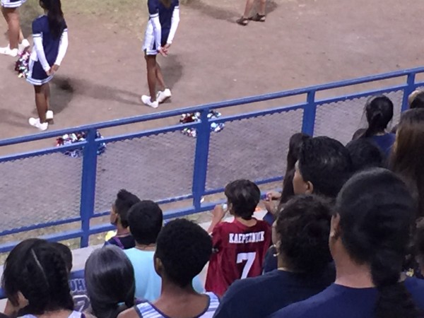 Kaepernick stands during the national anthem before the Waianae-Kaiser game. 