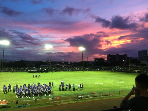 The Pearl City Chargers sing their alma mater before Saturday night's game against Waipahu. 