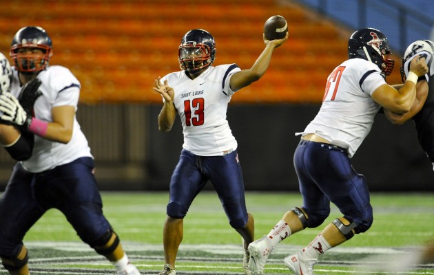Saint Louis QB Tua Tagovailoa threw for two touchdowns and rushed for another in a win over Kamehameha. Photo by Bruce Asato/Star-Advertiser.