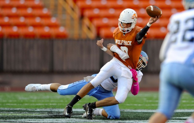 Pac-Five senior quarterback Ryan Johnson faced a tough pass rush by St. Francis in the first quarter at Aloha Stadium,  Friday, Oct. 7, 2016. HSA Photo by Bruce Asato. 