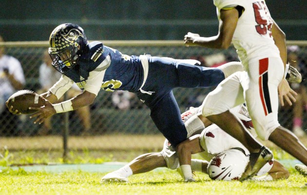 Waipahu's Alfred Failauga dove for a touchdown against Kalani. Photo by George F. Lee/Star-Advertiser.