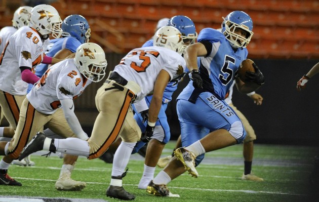 St. Francis' Supilani Mailei advanced a blocked punt against Pac-Five. Photo by Bruce Asato/Star-Advertiser.