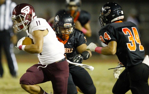 2016 October 14 SPT - HSA Photo by Jamm Aquino. Campbell linebacker Dane Esprecion (1) and defensive back Noah Empron (34) work to bring down Farrington wide receiver Mosi Alaivanu-Afe (11) during the first half of an OIA football game on Friday, October 14, 2016 at Campbell High School in Ewa Beach.