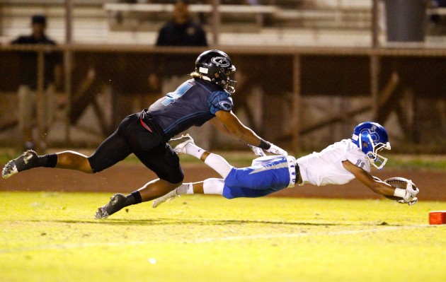 Moanalua wide receiver Rylan Miguel dove into the end zone for a touchdown against Kapolei in the OIA D-I quarterfinals. Photo by Jamm Aquino/Star-Advertiser. 