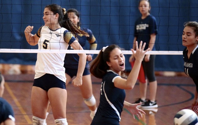 2016 October 15 SPT - HSA Photo by Jamm Aquino. Punahou outside hitter Keliiakekaipukaamaka McComber (5) reacts after a point against the Kamehameha-Kapalama Warriors during the first set of a girls ILH volleyball game between the Punahou Buffanblu and the Kamehameha-Kapalama Warriors on Saturday, October 15, 2016 at Hemmeter Fieldhouse.