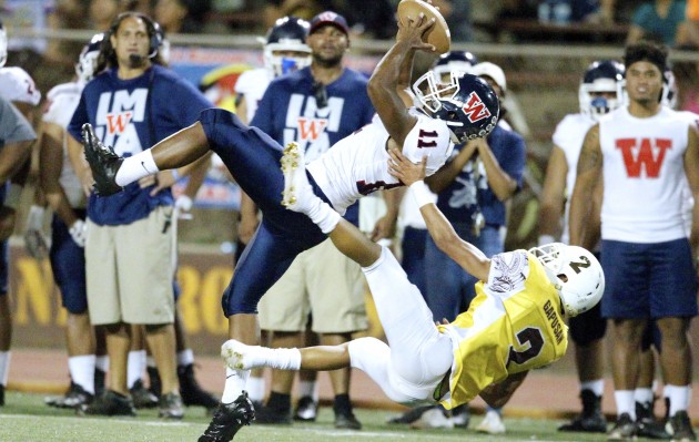 Waianae's Isaiah Freeney made this acrobatic catch on a pass from Jorell Pontes-Borje against the defense of Mililani's Dustin Gapusan. George F. Lee / Honolulu Star-Advertiser.