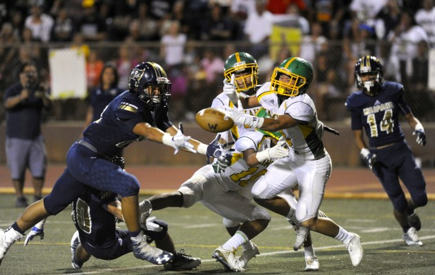 2016 September 30 SPT - HSA Photo by Bruce Asato  - Waipahu’s Isaac Yamashita lunges for the loose ball deflected into the end zone and caught it for a touchdown with seconds left in the second quarter of the Kaimuki vs Waipahu football game at Mililani's John Kauinana Stadium, Friday, September 30, 2016.