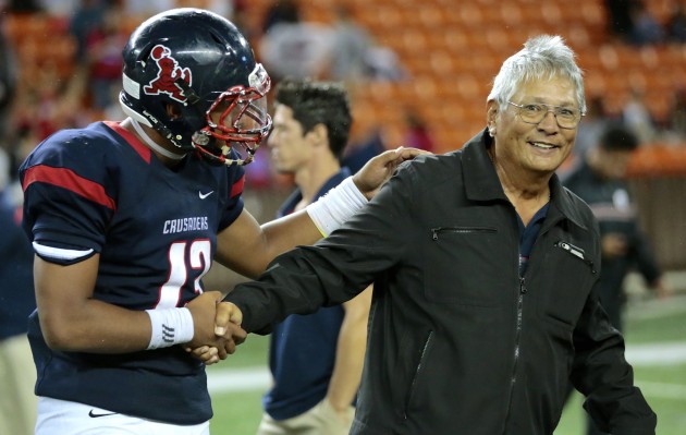 Saint Louis coach Cal Lee smiled after getting a handshake from his QB, Tua Tagovailoa, following a 28-14 win over Punahou. Photo by Jamm Aquino/Star-Advertiser.
