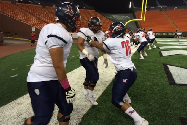 Saint Louis prepares to face Kamehameha. Photo by Bruce Asato/Star-Advertiser.