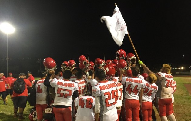 The Waialua Bulldogs raised their flag after ousting Kaimuki in the OIA Division II semifinals. Brian McInnis / Star-Advertiser