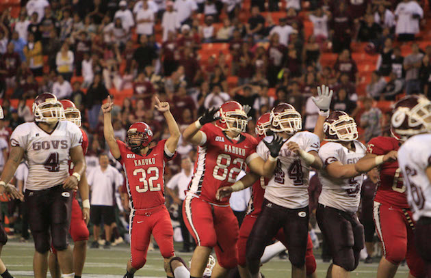 Kahuku's St. John Lessary III raised his arms after kicking the game-winning field goal to give the Red Raiders a 22-19 win over Farrington in overtime in the 2008 OIA title game. Photo by Jamm Aquino/Star-Bulletin.