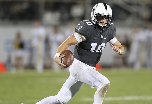 UCF quarterback McKenzie Milton, who graduated from Mililani earlier this year, scrambled against Temple on Saturday. Milton has started three games at QB as a true freshman for Knights. Associated Press photo.