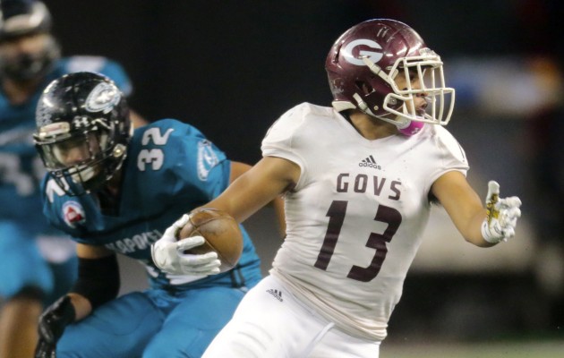 2016 October 22 SPT - HSA Photo by Jamm Aquino. Farrington running back Challen Faamatau (13) jukes out Kapolei linebacker Floyd Tasaka (32) during the first half of an OIA semifinal game between the Farrington Governors and the Kapolei Hurricanes on Saturday, October 22, 2016 at Aloha Stadium.