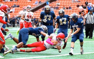 Waialua QB Tevesi Toia dives for the end zone to get the Bulldogs' first TD of the game. Photo by Jamm Aquino/Star-Advertiser.