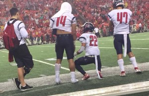 Saint Louis LB Isaac Slade-Matautia (14) had six tackles before injuring his left arm. Photo by Christian Shimabuku/Star-Advertiser.