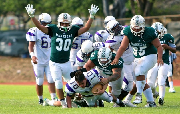 Fans who don't make it to the stadium or order pay-per-view can watch the three high school football state championship games in day-after replays on OC 16. In photo, Kapaa's Ikona Fernandez (30) sacked Damien quarterback Marcus Faufata-Pedrina in a Division II semifinal game last week. Jesse Castro / Special to the Honoulu Star-Advertiser.