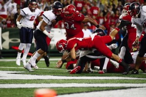 Kahuku's Elvis Vakapuna gives the Red Raiders a 7-6 lead on a 1-yard TD run in the second quarter. Photo by Jamm Aquino/Star-Advertiser.