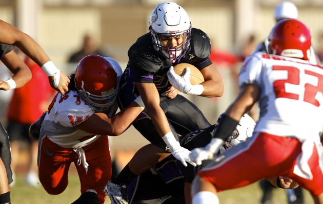 Damien running back Deacon Kapea battled for yards against Waialua. Photo by Jamm Aquino/Star-Advertiser.