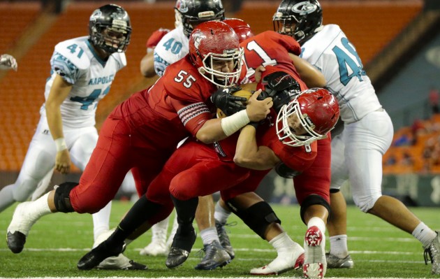 Kahuku running back Harmon Brown (8) barreled into the end zone with help from offensive lineman Vili Fisiiahi against Kapolei. Photo by Jamm Aquino/Star-Advertiser.