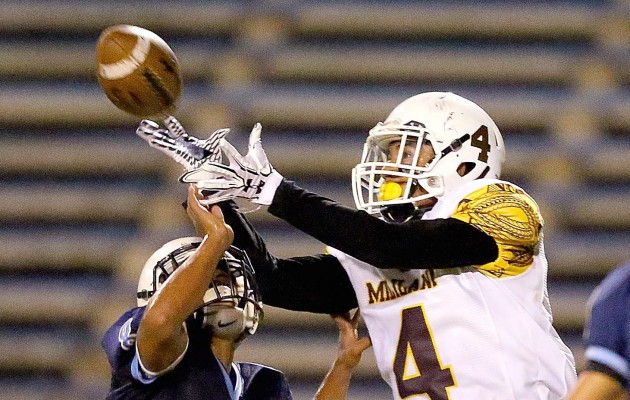 Mililani's Andrew Valladares caught a pass against Kailua last season. It's possible the OIA will change from two divisions to three tiers in 2018, according to league football coordinator Harold Tanaka. Last season, Mililani won the state's title in Division I, which is the second tier of three statewide. The OIA plans to play its regular season in two tiers in 2017. Jay Metzger / Special to the Honolulu Star-Advertiser.