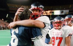 Saint Louis QB Timmy Chang was congratulated by Kamehameha's Ikaika DuPont after the Crusaders won the 1999 ILH title. Star-Bulletin photo by George F. Lee.