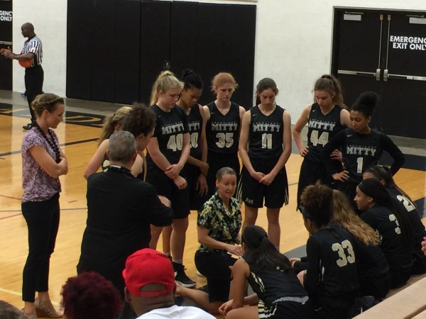 Archbishop Mitty coach Susan Phillips talks with her  team during a time out. The Monarchs overpowered defending tournament champion Konawaena 79-39 in opening-round play. 