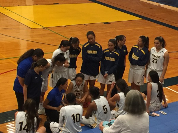 Punahou strategizes during a time out. Thursday, Dec. 16, 2016.