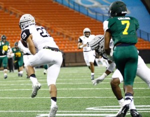 Kahuku's Codie Sauvao picks off a pass in the second quarter of the Polynesian Bowl. Photo by Jamm Aquino/Star-Advertiser.