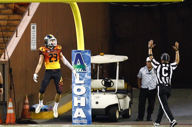 Aiea's Gage Asing celebrated after his 74-yard interception return for a TD. Photo by Jamm Aquino/Star-Advertiser.